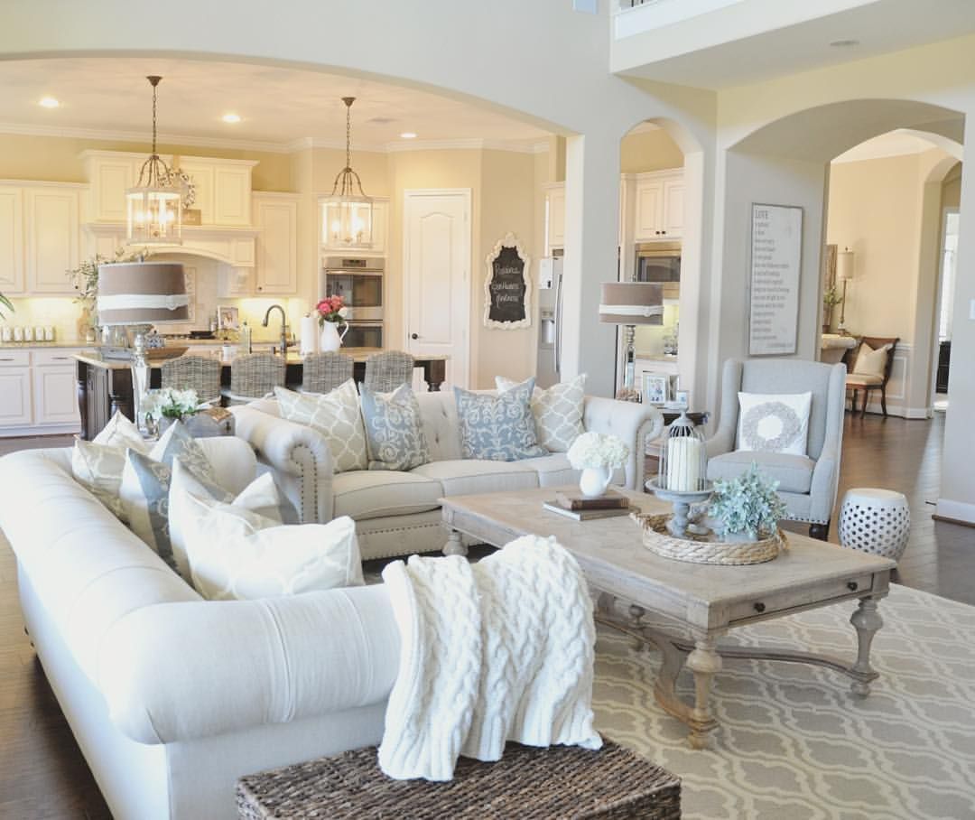 There is just something we love about this fresh, yet warm and inviting living room. Maybe its the abundance of pillows!  We