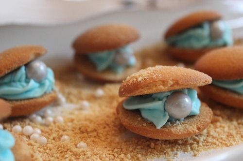 Under the Sea Party Oysters from DIY Louisville made with Vanilla Wafers, Shimmer Sixlets and Pearls, blue frosting, and a