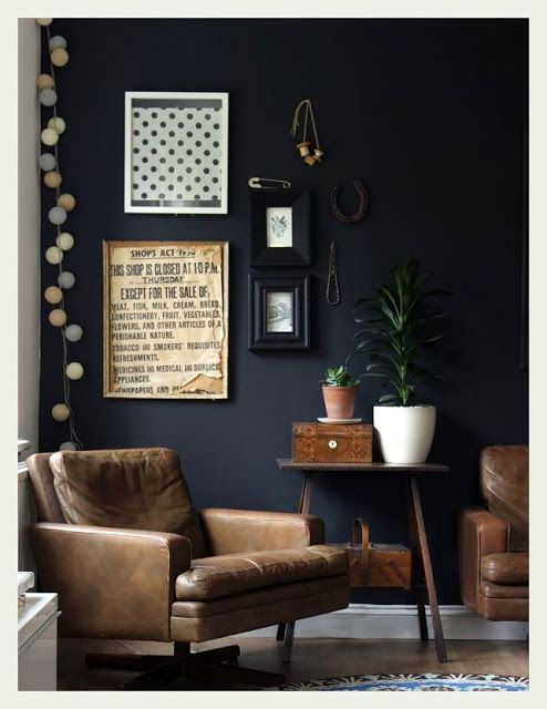 An Indian Summer. Leather chairs and dark charcoal walls.