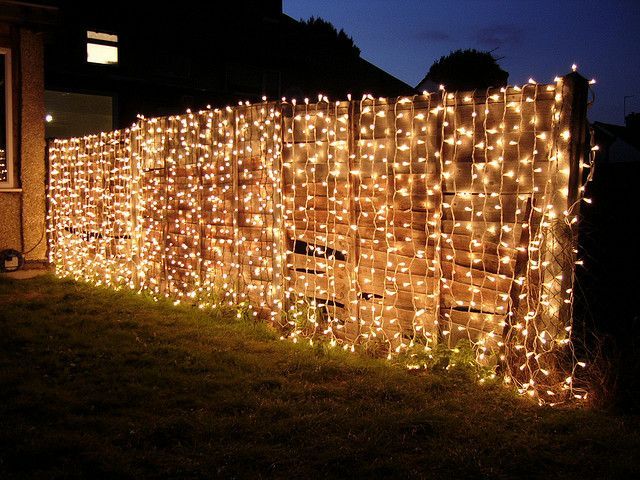 curtain lights on fence for night-time garden party