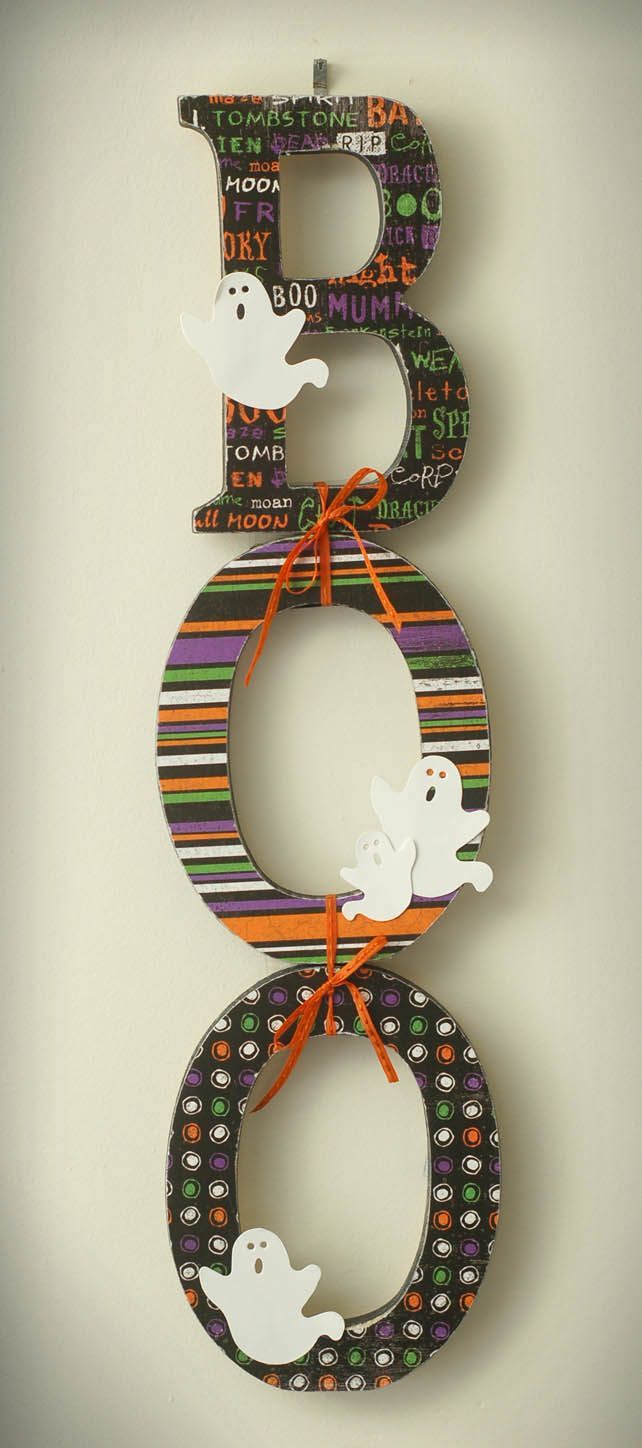 Cute “BOO” sign made with wood letters, scrapbook paper, and embellishments.  Love the way they are tied together!