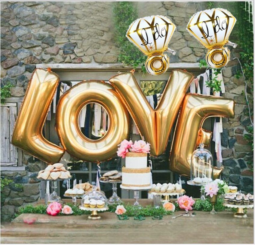 Engagement party decor idea – gold LOVE balloons and diamond balloons with dessert display {Courtesy of Sharing Party Ideas}