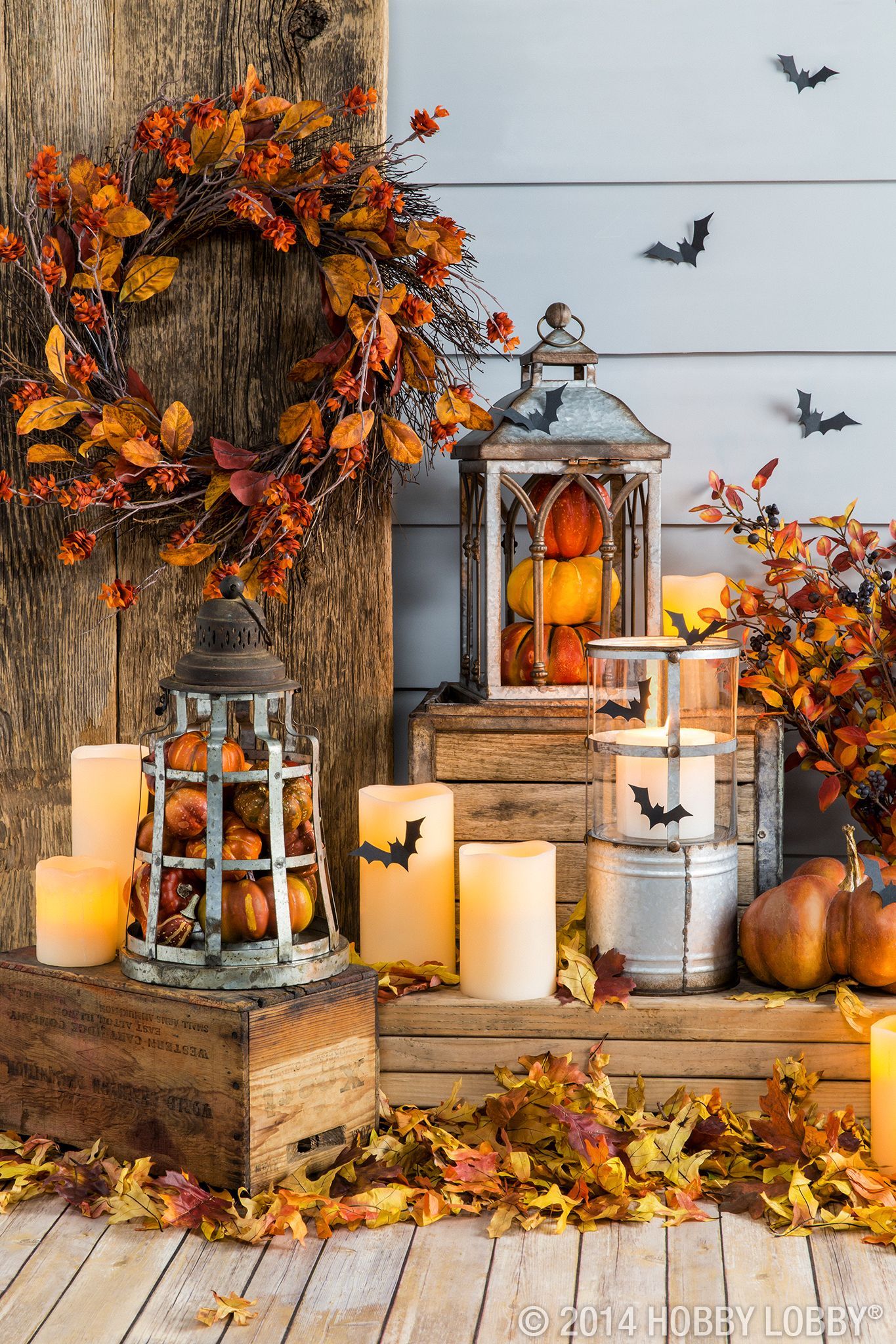 Fill lanterns with pumpkins and other fall pieces for an easy DIY-decor idea. #chic_autumn_decor