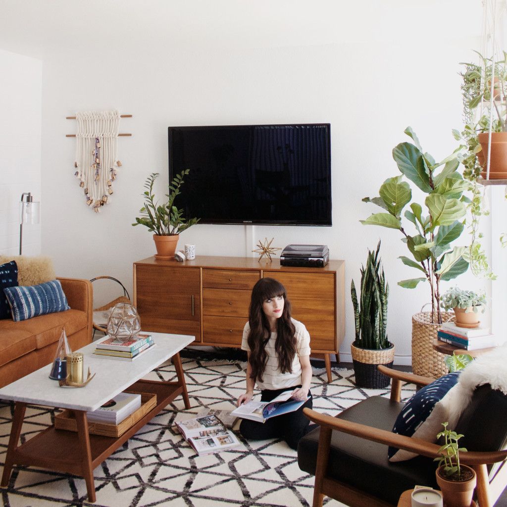 Great space using pieces from West Elm. Like the way the TV is camouflaged with the plants somewhat  //  New Darlings - Living