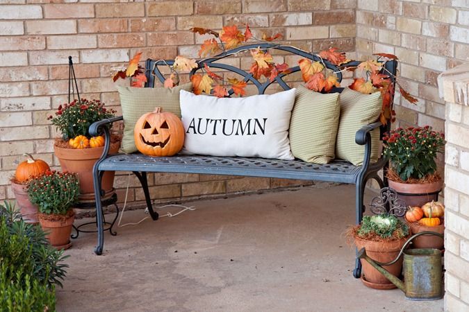 I love the mums in the clay pots with the little pumpkins! Too cute.