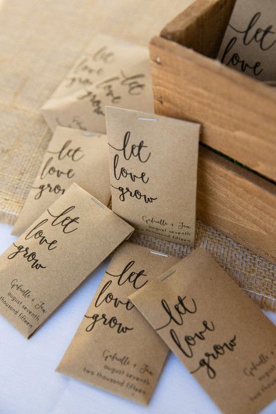 Kraft paper seed packets with “let love grow” in modern calligraphy as favors {Candace Jeffery Photography}