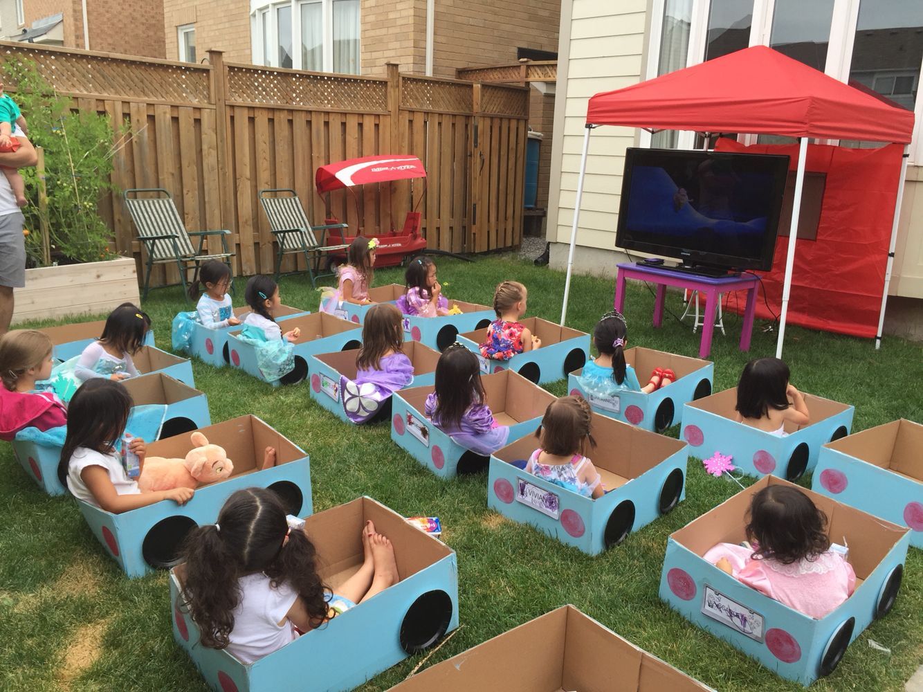 Leahs Drive-in movie birthday party.  Its daylight so a projector screen probably wouldnt work so we lugged a TV outside.