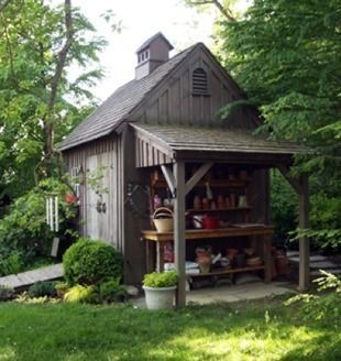 Nice shed with attached potting bench with cover. Also note the double doors and ramp.