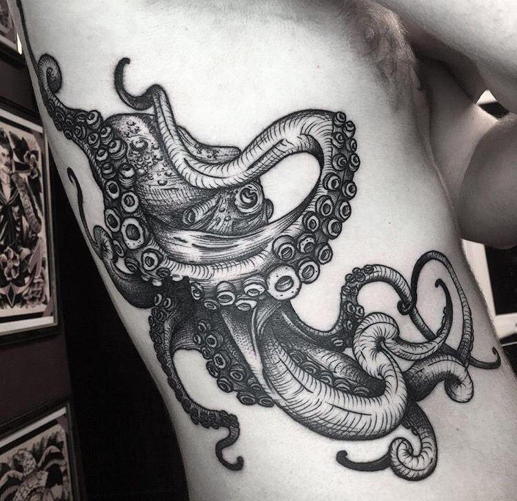 Octopus tattoo. amazing chest/under arm nautical tattoo done with simple black ink