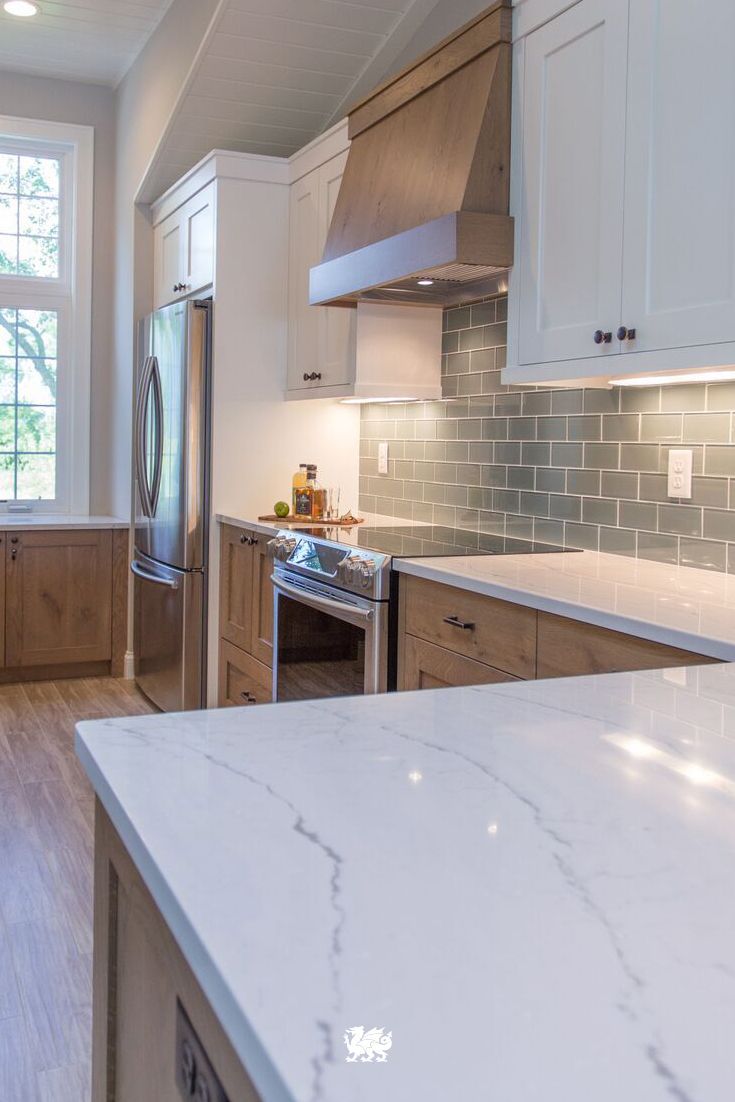 Our Ella™ quartz countertop is a soothing complement to a beachy and coastal kitchen renovation by @JKathDesignBuil