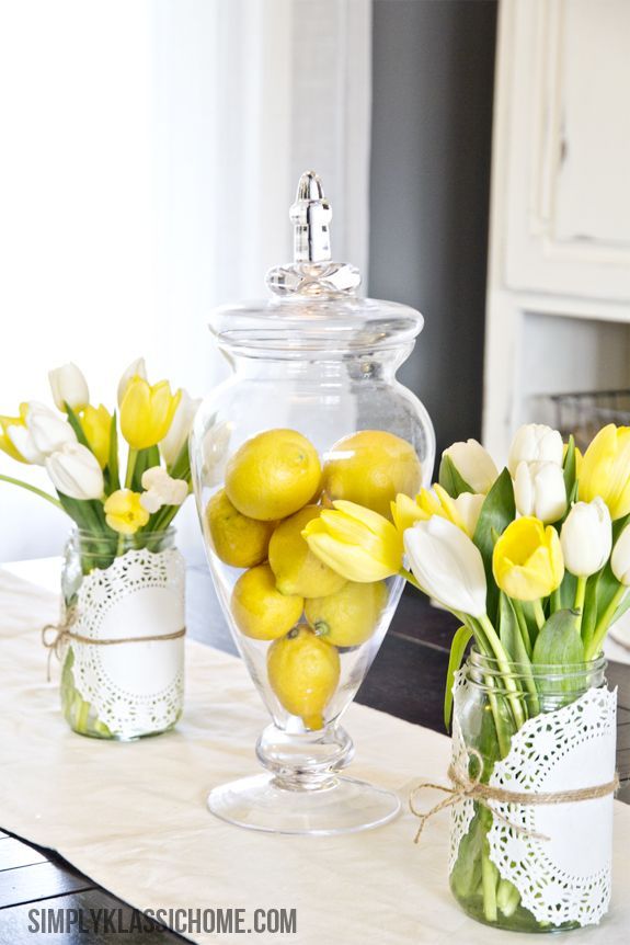 The bright colors in these Easter centerpieces make us happy! Create your own with twine found here: www.lightsforallo… Mason