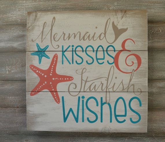 This wood sign features the words Mermaid Kisses and Starfish wishes painted in deep coral, turquoise and light tan all on a off