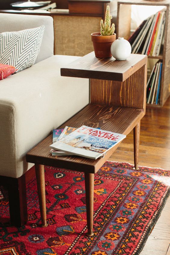 Tiered mid-century modern side table. Great idea for creating storage, from plants to magazines to remote controls. This looks