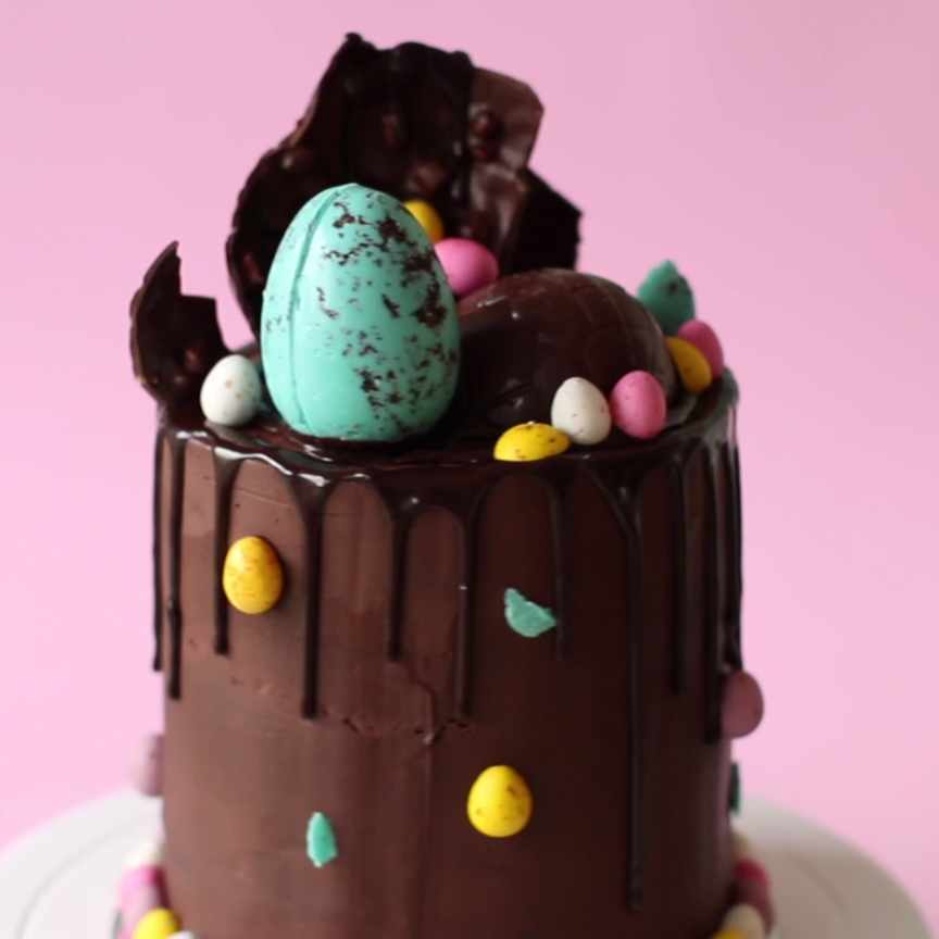 Topped and stuffed with candy speckled eggs, this super chocolatey cake will satisfy any sweet tooth on Easter!