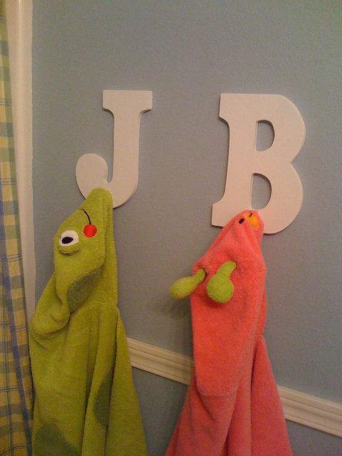 Towel Racks – easy to DIY with letters from Hobby Lobby and pegs from Home Depot (Im actually thinking this might be good for the