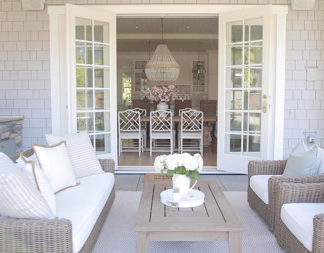 coastal style. Outdoor living. French doors . Patio design . Covered patio. ro sham beaux orbit chandelier. @jshomedesign