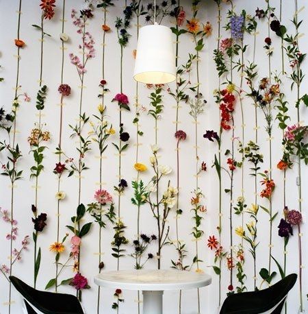 Decorate an entire wall with faux flowers.