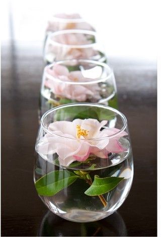 Float individual blooms in glass cups for an easy, modern centerpiece. 10 Easy And Affordable Ideas For Party Decor | Lovelyish