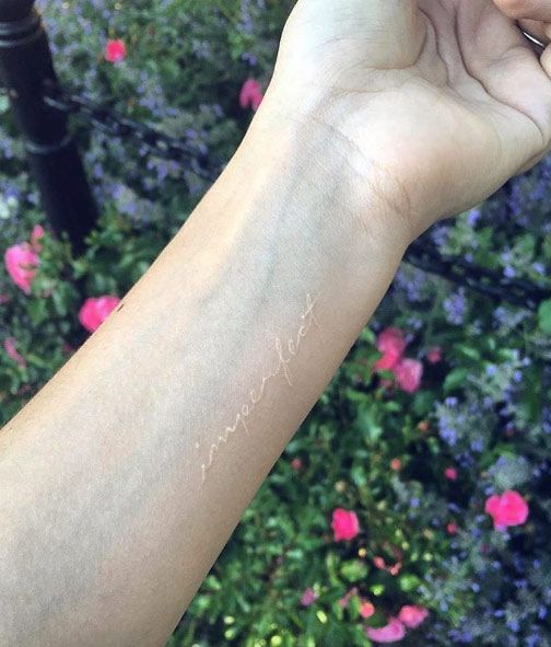 ‘Imperfect’ white ink wrist tattoo by Kristi Walls