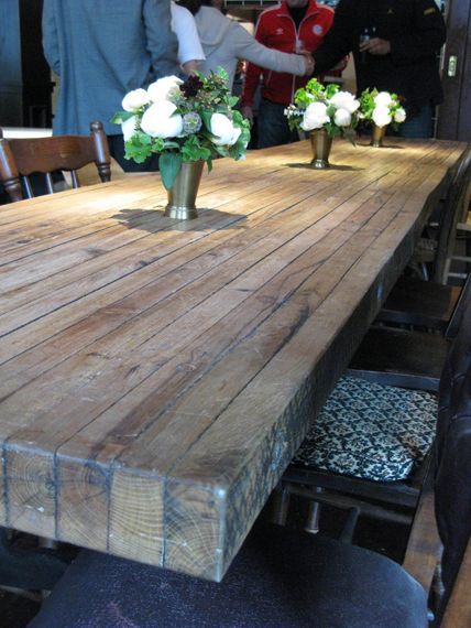putting the planks on their ends for a DIY table top – would make a great rustic table for the back porch