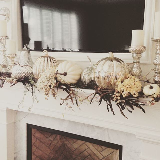 Real pumpkins mix with metallic HomeGoods pumpkins for elegant effect on this mantle.