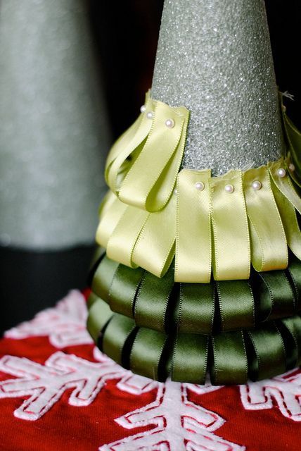 Ribbon Christmas Tree – Id do red/white/silver and would find some kind of star topper to hide the top of the styrofoam and raw
