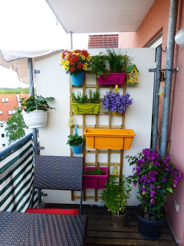 Vertical Balcony Garden Ideas | This is one cheap solution you should look at. Planters are hanged on this wooden bracket mounted