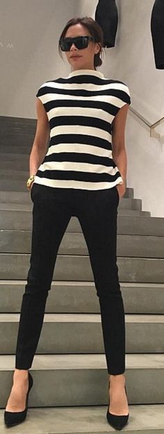 //Who made Victoria Beckhams black pants, sunglasses, and white stripe shirt?