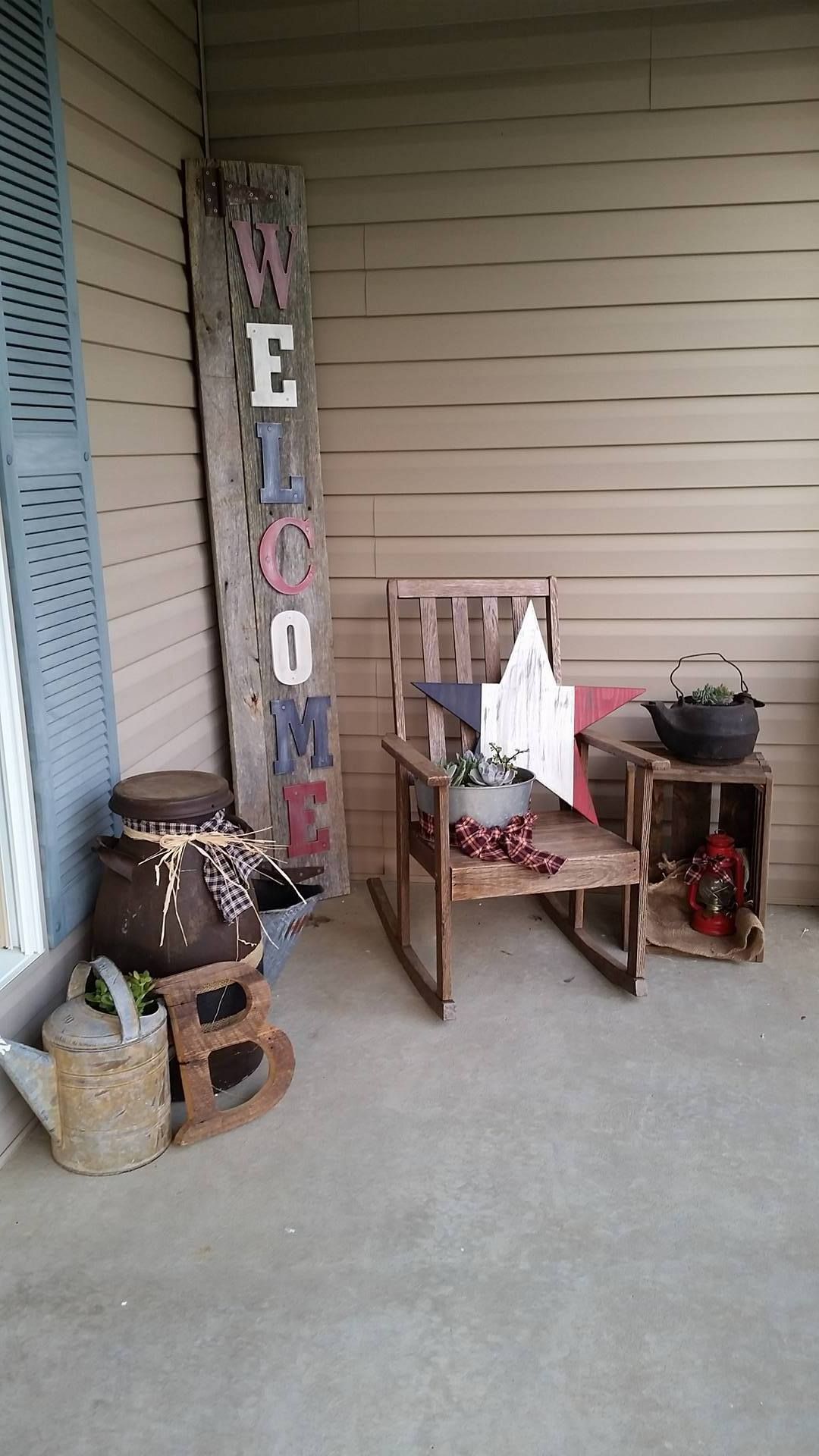 barnwood sign and letter, old chair, old milk can, watering can, cast iron pot all make for a nice decoration on the porch