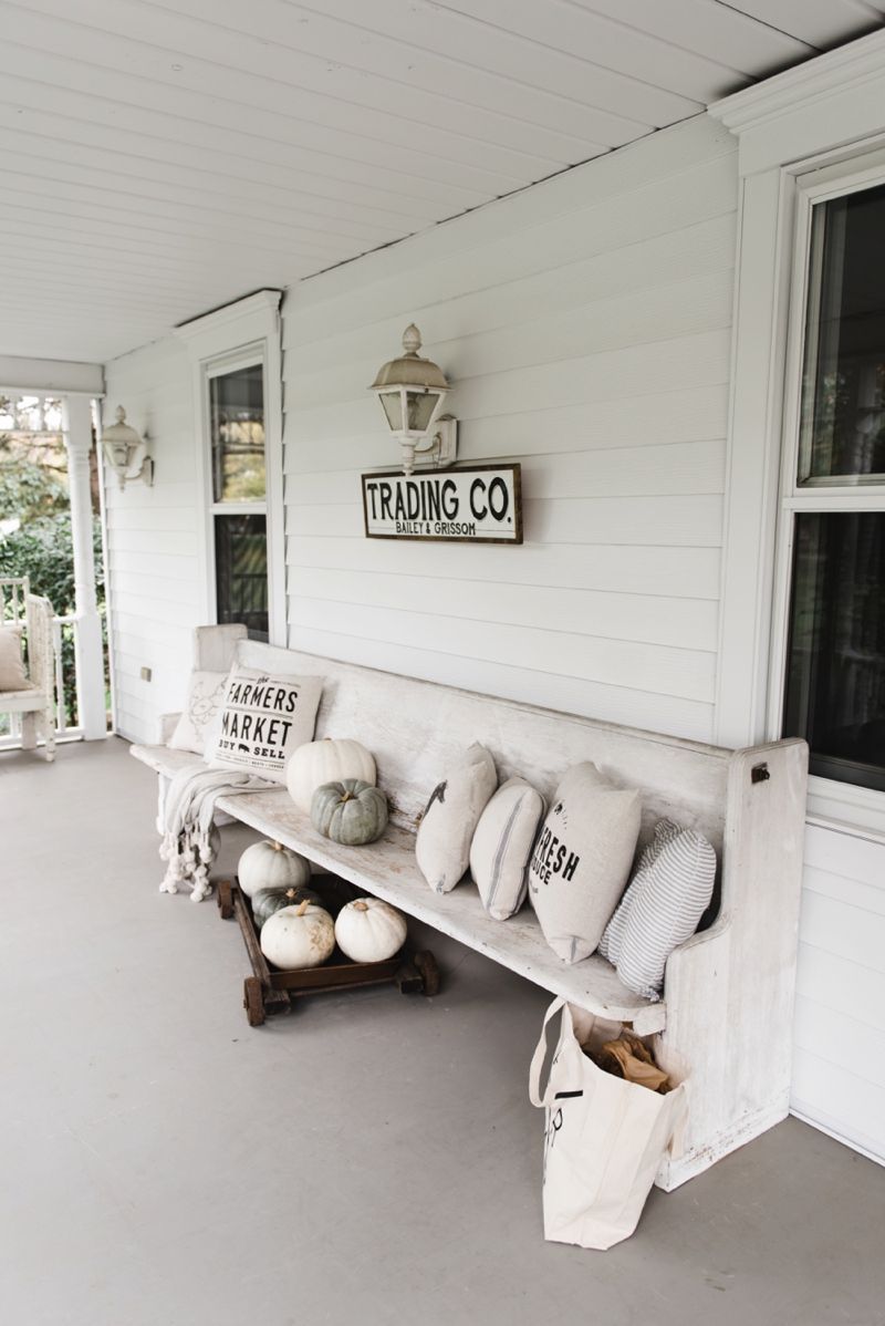 Farmhouse style porch – Church pew and farmhouse pillows on a porch… the perfect combo.