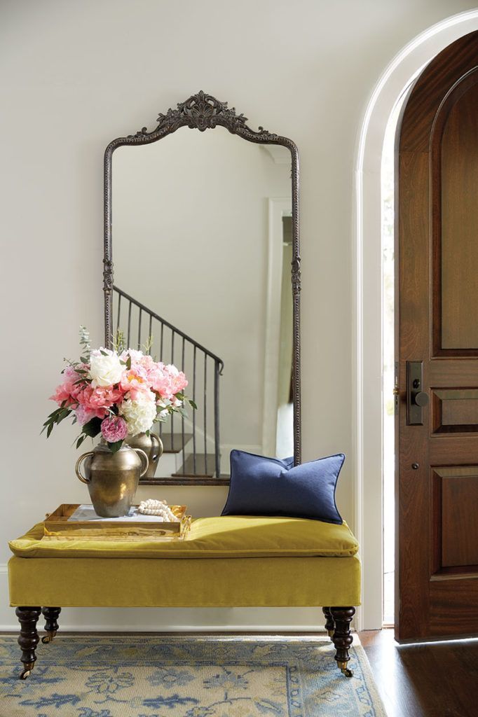 Filling a Blank Entryway: Make a grand entrance with a large-scale mirror and a velvet pillowtop bench!