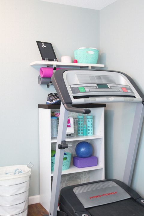 great way to organize workout stuff in a small space. free weights are on the bottom shelf.