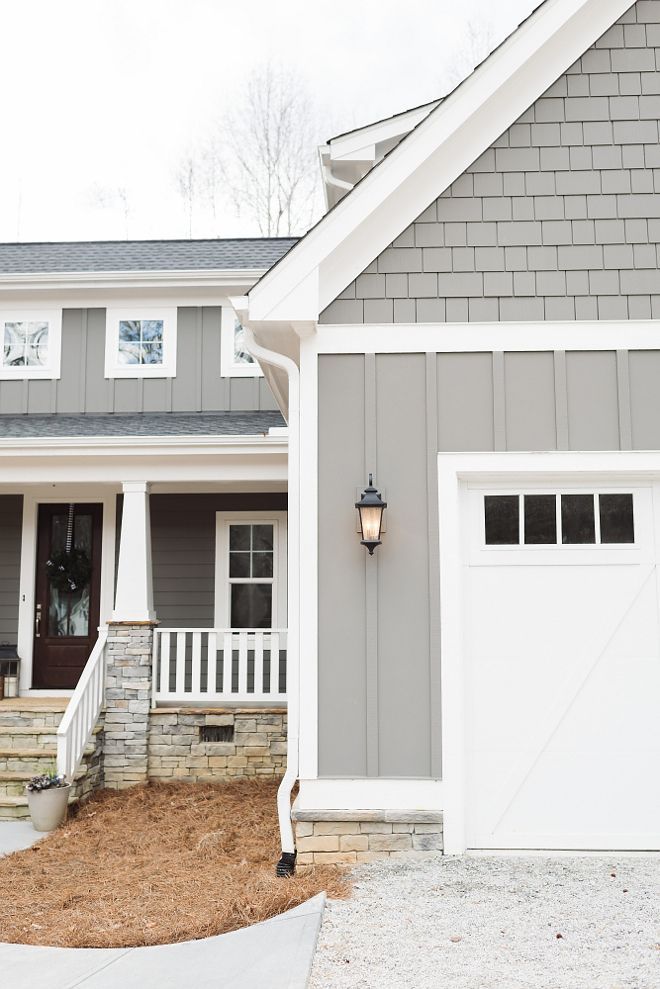 Grey siding paint color is Gauntlet Gray Sherwin Williams and white trim paint color is Snowbound by Sherwin Williams.