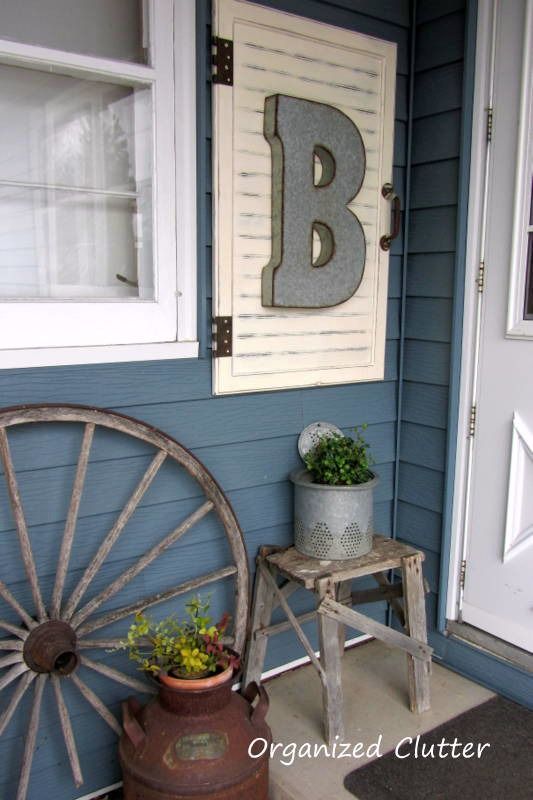I have two shutters that this might work! Outdoor Junk Vignette & Cabinet Door Decor Project Tutorial