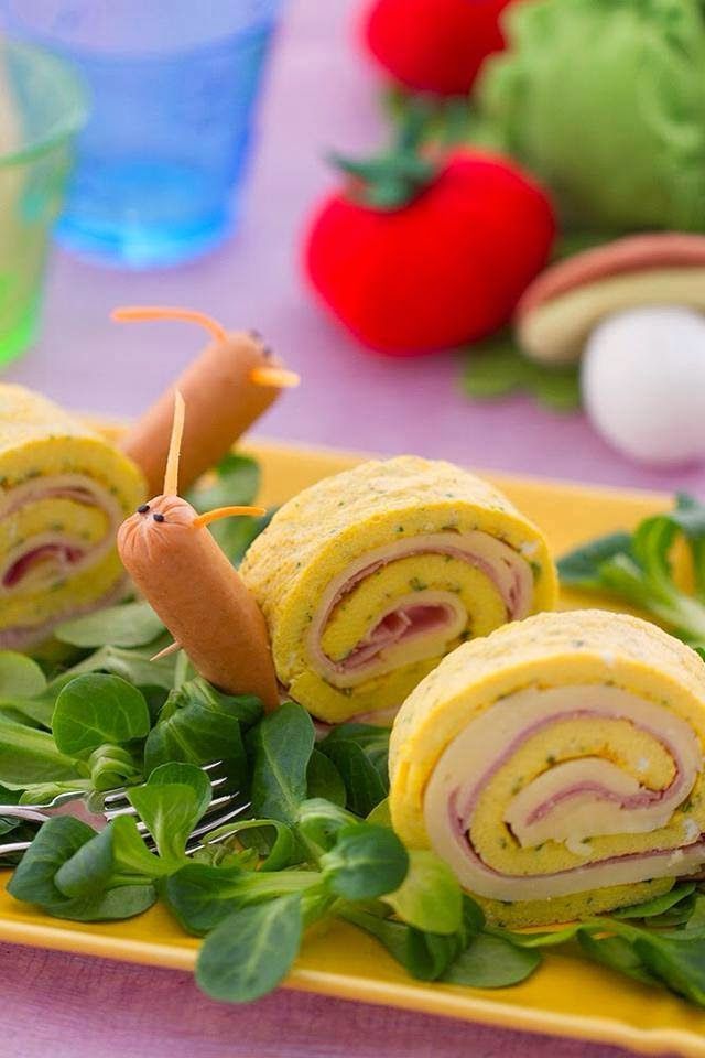 Snail pinwheel sandwich bites with Vienna sausage heads – could be done with an ommellette and ham