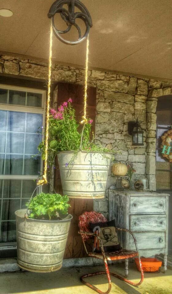 This is a great idea! The plants look a little scraggly but you can fix that with a trip to Wight’s! Cast iron pulley with buckets