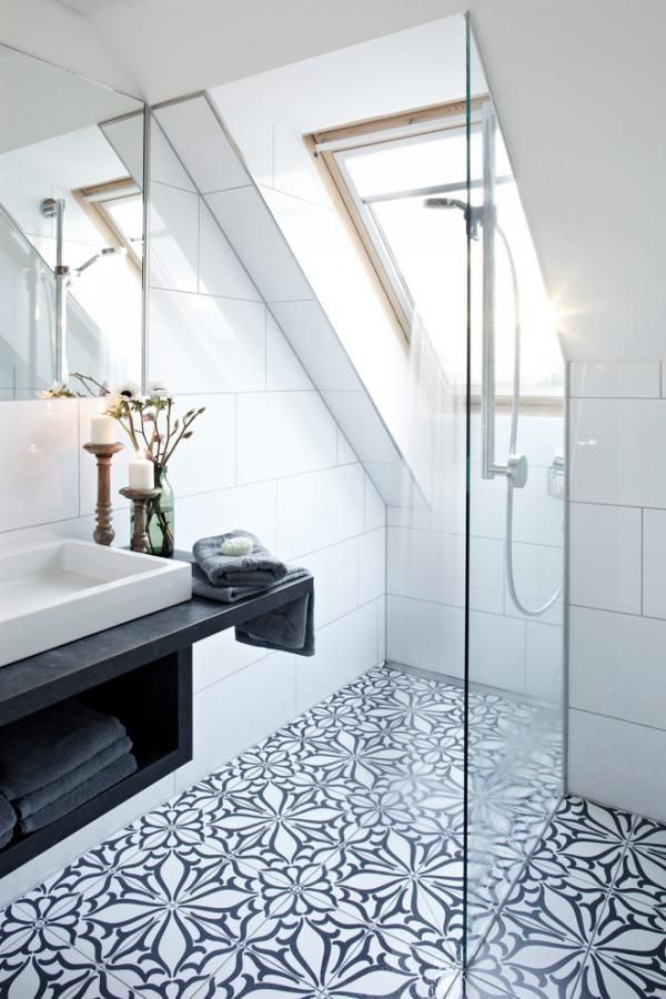 This loft bathroom has all the trademarks of Scandinavian style, with large white tiling, but they have made it much more