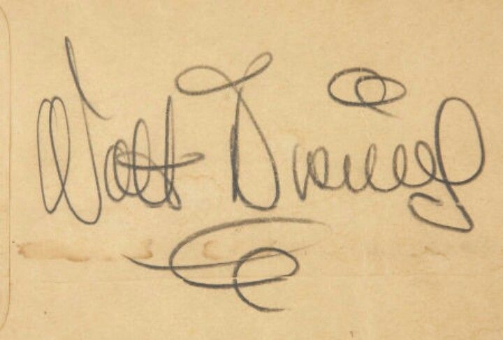 Walt Disney’s signature. the D looks nothing like the one they use for the logo.