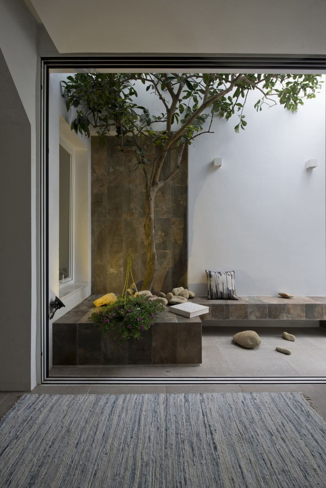 Would make a nice outdoor “sitting area” for the outdoor shower area, to towel off, relax, sip coffee, and all that……..