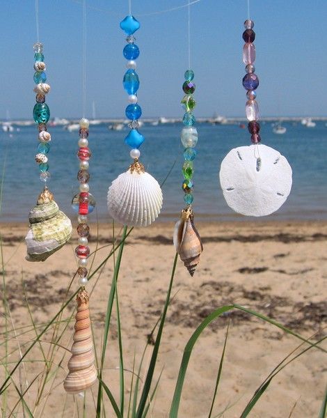 collect as many shells as you can find later get a string but not too heavy and start to tie the string around the shells and sand
