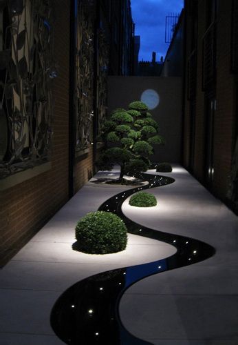 Cool curved path with lights.  Wow! [ TheGardenFountainStore.com ]