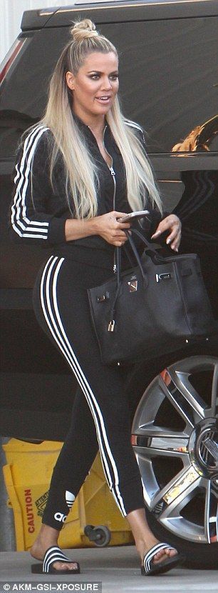 Heading home: The reality star smiled and chatted after another day at the studios for her… KHLOE