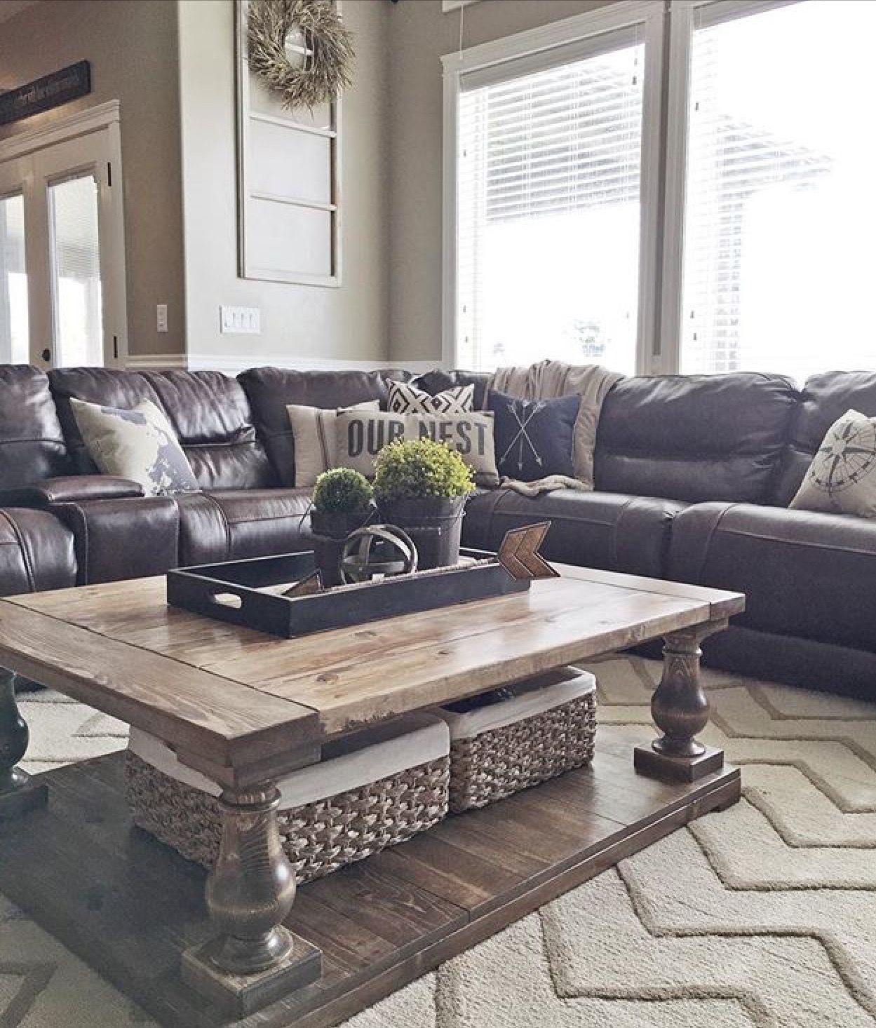 Leather sofa with throw pillows, rug