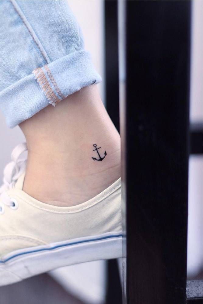 Tiny anchor tattoo on the right inner ankle….