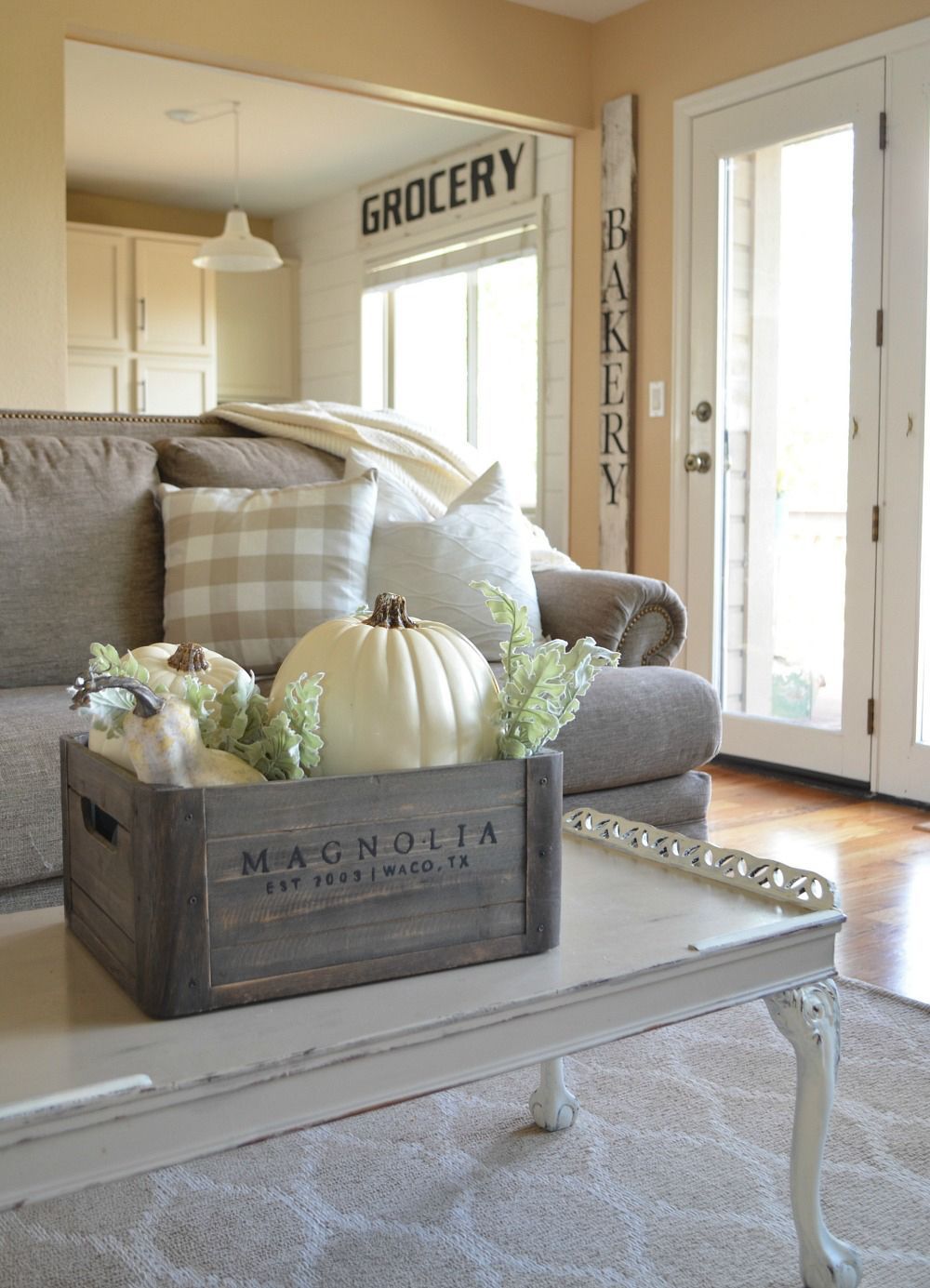 Wooden crate with white pumpkins and a bit of greenery make a great simple Fall centerpiece