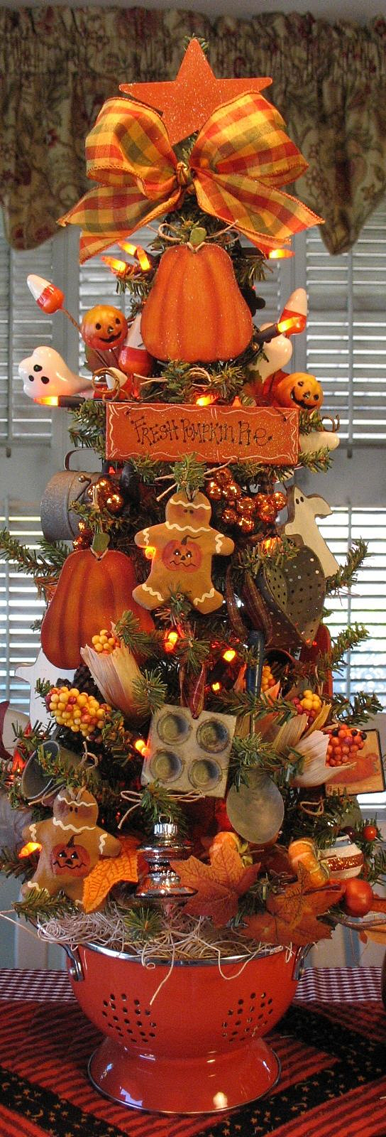 A Fall/Autumn decorated small tabletop Christmas tree