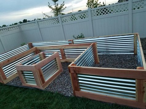 Beautiful custom raised garden bed my husband and I just finished. It turned out perfect!  Used redwood and galvanized sheet