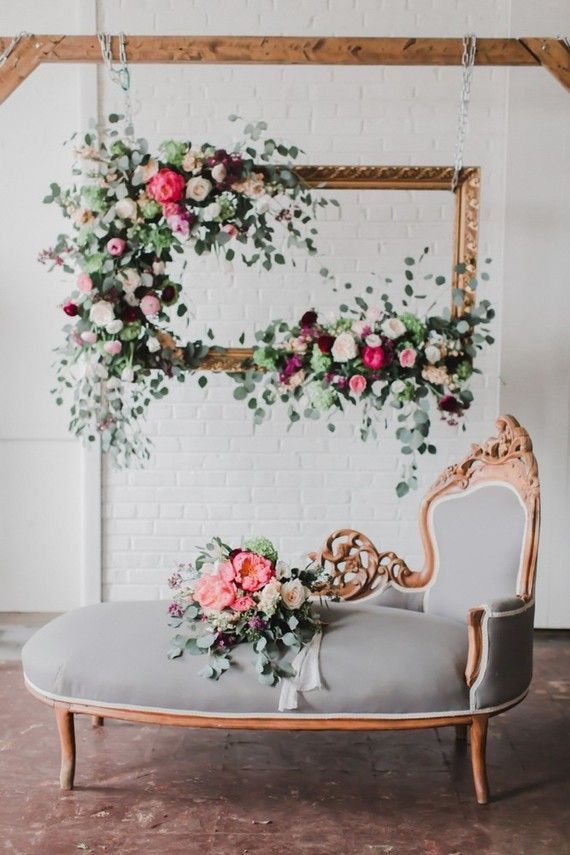 Beautiful idea for a photo station. Like a rustic or gilded frame with patina, augmented with flowers and leaves