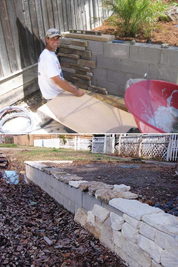 Build a backyard retaining wall with concrete blocks and then adorn it with stone facade. Nice!
