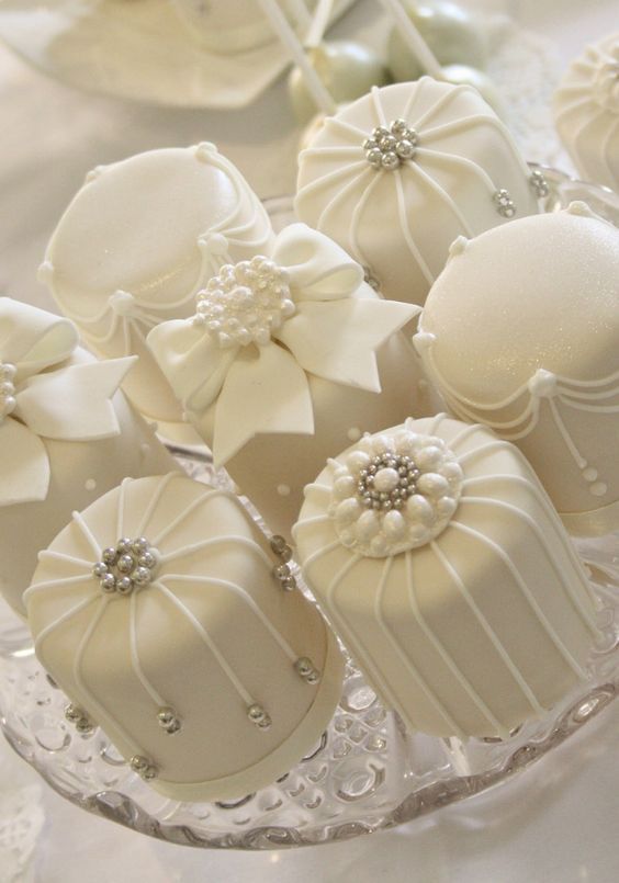 Featured Cake: Cotton  Sophisticated studded mini white cream wedding cakes
